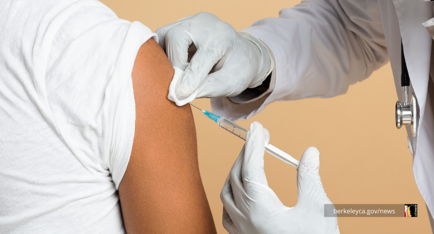Person receiving a vaccine from medical professional